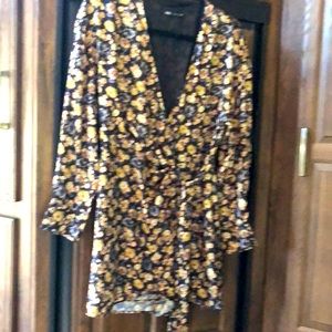 Floral jumpsuit.Never been used. Zara brand size small.